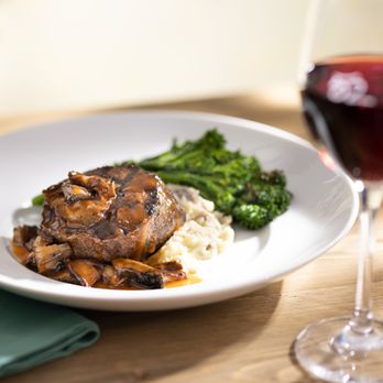 Seasons 52 - Wood-Grilled Filet Mignon served with broccolini, Yukon mash, red wine and mushroom sauce. - New American Near Me - Indianapolis, Indiana Seasons 52 - Wood-Grilled Filet Mignon served with broccolini, Yukon mash, red wine and mushroom sauce. - New American Near Me - Indianapolis, Indiana