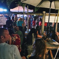 Seating area to eat + small stage for entertainment in the background. Makawao Third Friday