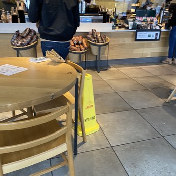 Starbucks - a man standing at a counter in a coffee shop - Coffee & Tea Near Me - Colonial Heights, Virginia Starbucks - a man standing at a counter in a coffee shop - Coffee & Tea Near Me - Colonial Heights, Virginia