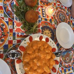 Gnocchi with tomato cream sauce and arancini