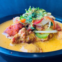 Rollz Rice Indian Kitchen - Tikka Masala Bowl  Bowl made w/basmati rice, choice of protein, tomato corn salsa and warm tikka masala curry.