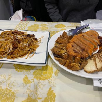 Bodhi Village - Veggie Roast Meat Chow Fun (left) Five Happiness Appetizer (right) - Vegetarian Near Me - Flushing, New York Bodhi Village - Veggie Roast Meat Chow Fun (left) Five Happiness Appetizer (right) - Vegetarian Near Me - Flushing, New York