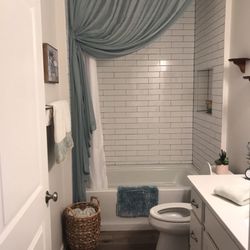 Before both curtains fell off the tile wall