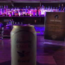 a can of beer on the bar