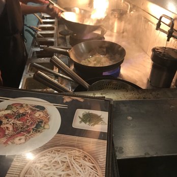 Sésame - a cook preparing a meal in a restaurant kitchen - Asian Fusion Near Me - Montreal, Quebec Sésame - a cook preparing a meal in a restaurant kitchen - Asian Fusion Near Me - Montreal, Quebec