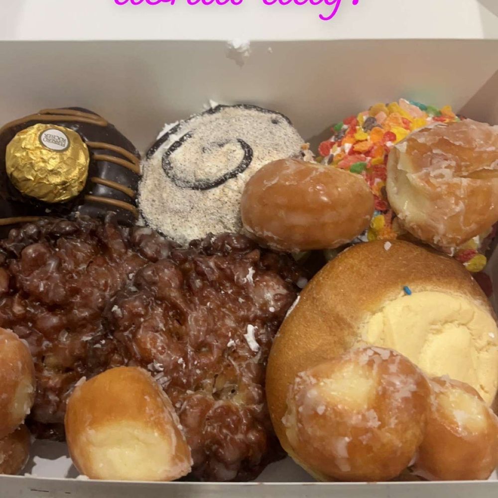 Ferrero Rocher Donut, Cappuccino Donut, fruity pebble donut, 2 Apple Fritter Donuts, and a cream cheese donut Ferrero Rocher Donut, Cappuccino Donut, fruity pebble donut, 2 Apple Fritter Donuts, and a cream cheese donut