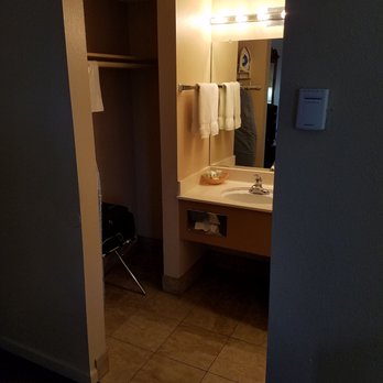 Hardman House - The closet and bathroom sink with a vanity mirror. - Hotels Near Me - Carson City, Nevada