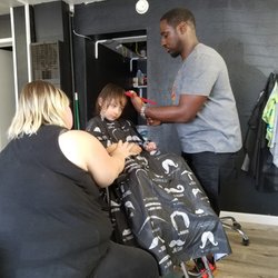 Taperz Barbershop - Sherman giving first haircut