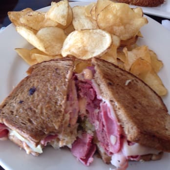 Benedict's Restaurant - The Reuben and house chips. - New American Near Me - Dunedin, Florida Benedict's Restaurant - The Reuben and house chips. - New American Near Me - Dunedin, Florida
