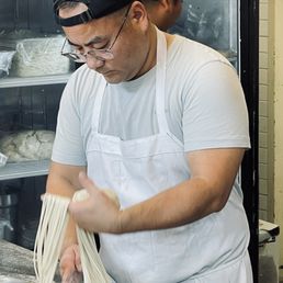 Chef pulling noodles by hand!