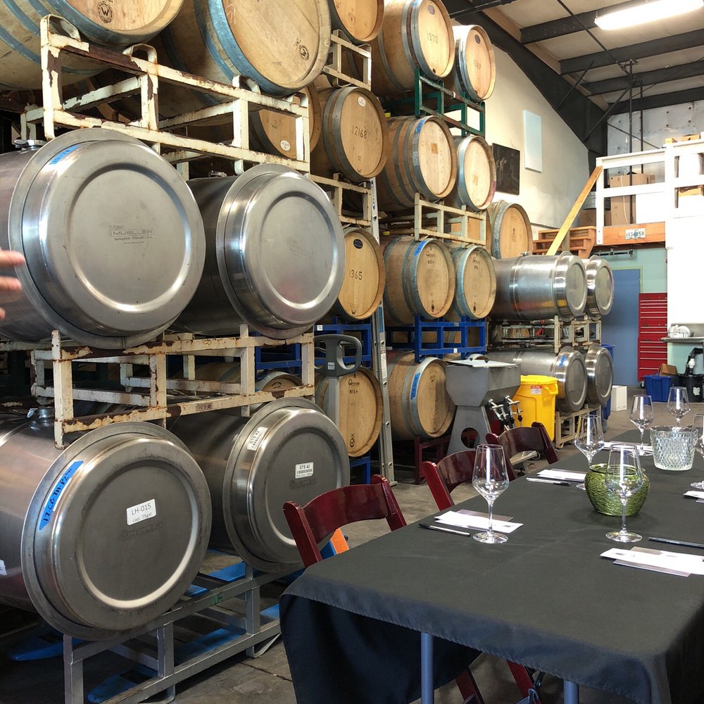 Roark Wine Company - a table with wine glasses on it - Wine Tasting Room Near Me - Buellton, California