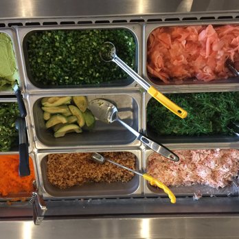 Pokiology - Toppings - L to R Top to bottom - wasabi, green onions, ginger, jalapeños, avocados, seafood salad, masago tempura crunchies & crab meat - Poke Near Me - Chicago, Illinois