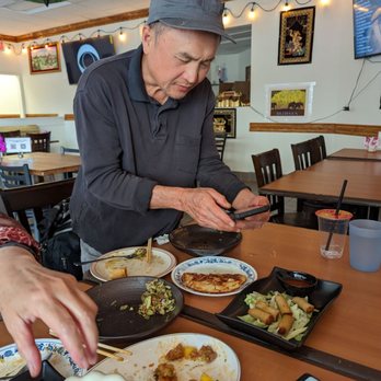 Bagan Burmese Kitchen - Man taking picture - Burmese Near Me - Los Angeles, California Bagan Burmese Kitchen - Man taking picture - Burmese Near Me - Los Angeles, California