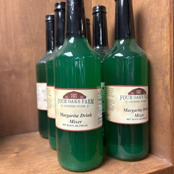 Four Oaks Farm - bottles of wine on a shelf - Meat Shops Near Me - Lexington, South Carolina Four Oaks Farm - bottles of wine on a shelf - Meat Shops Near Me - Lexington, South Carolina