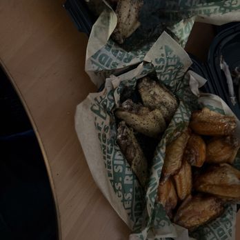 Wingstop - two baskets of food on a table - Chicken Wings Near Me - Alameda, California Wingstop - two baskets of food on a table - Chicken Wings Near Me - Alameda, California