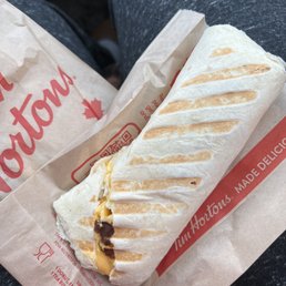 a burrito wrapped in paper a burrito wrapped in paper