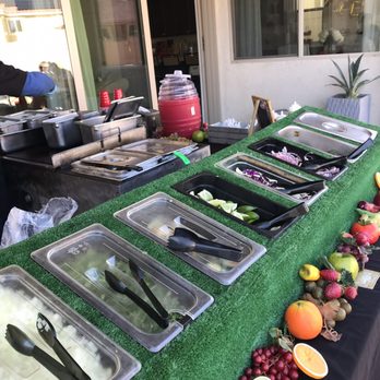 Ambrosio’s Taco Bar - Fresh onions, cilantro, limes, cucumbers, cabbage and pickled onions. - Caterers Near Me