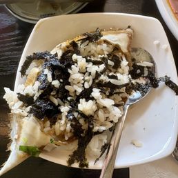 The waiter helped us mix rice, roasted seaweed, and sesame oil with the delicious stuff inside the crab shell.