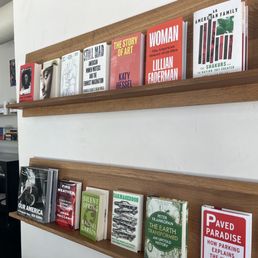 a wall of books in a bookstore a wall of books in a bookstore