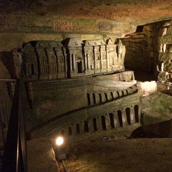 Les Catacombes de Paris - Extensive art has been carved into the walls - Local Flavor Near Me - Paris, 75 Les Catacombes de Paris - Extensive art has been carved into the walls - Local Flavor Near Me - Paris, 75