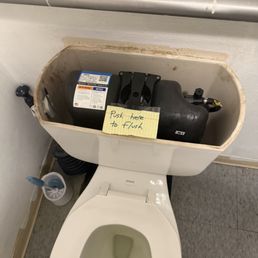 Toilet at Lighthouse Cafe asking you to put hands in tank to flush. Toilet at Lighthouse Cafe asking you to put hands in tank to flush.
