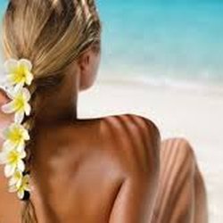 Beauty & the Artiste - Come get air brush spray tanned. The color I use is more of a red brown base so it does not come off looking orange.