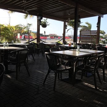 Red Fish - a restaurant patio with tables and chairs - Seafood Near Me - Queens, New York