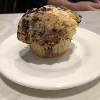 Blueberry Muffin - Blueberry muffin (after a few bites taken out of it on the other side...I couldn't resist!) - Breakfast & Brunch Near Me - Indialantic, Florida