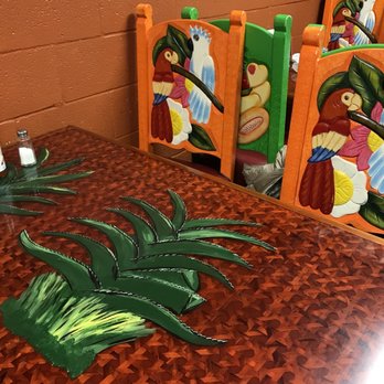 Taco Zone - a table and chairs with a painting on them - Mexican Near Me - Fort Wayne, Indiana Taco Zone - a table and chairs with a painting on them - Mexican Near Me - Fort Wayne, Indiana