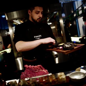 Fogón - Chef salting the meats - Steakhouses Near Me - Buenos Aires, C