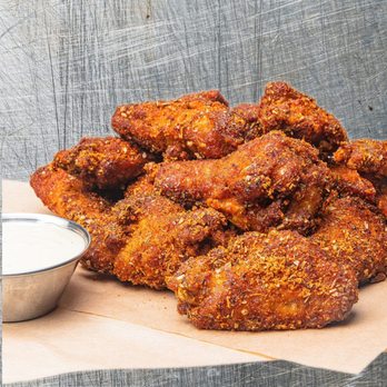 Wing Squad - a pile of fried chicken with a side of ranch dip - Food Delivery Services Near Me Wing Squad - a pile of fried chicken with a side of ranch dip - Food Delivery Services Near Me