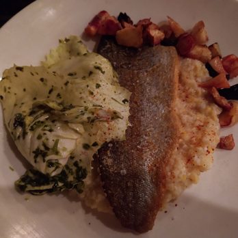 Rhubarb - Trout entree with raw cabbage leaves on top - New American Near Me - Asheville, North Carolina
