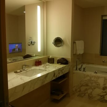 Four Seasons Hotel Seattle - TV in bathroom mirror - Hotels Near Me - Seattle, Washington