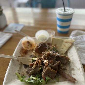 Luna Grill Palm Desert - Gyro plate with spicy harissa hummus, and side salad. - Greek Near Me - Palm Desert, California Luna Grill Palm Desert - Gyro plate with spicy harissa hummus, and side salad. - Greek Near Me - Palm Desert, California