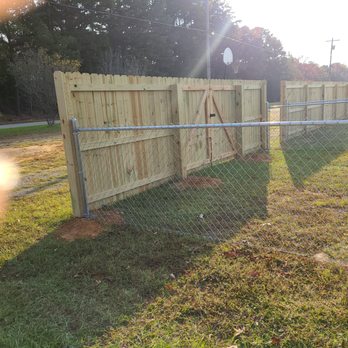 Ivy Fence - Here is where the biggest amount of wood to chainlink happens - Fences & Gates Near Me - Tupelo, Mississippi Ivy Fence - Here is where the biggest amount of wood to chainlink happens - Fences & Gates Near Me - Tupelo, Mississippi