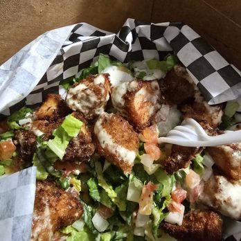 Wangs N Thangs - I ate half before the picture. So much chicken on the fried chicken salad. Excellent - Burgers Near Me - Venice, California