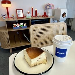 Cute place, nice vibe, great green tea, and a perfectly creamy cheesecake. Cute place, nice vibe, great green tea, and a perfectly creamy cheesecake.