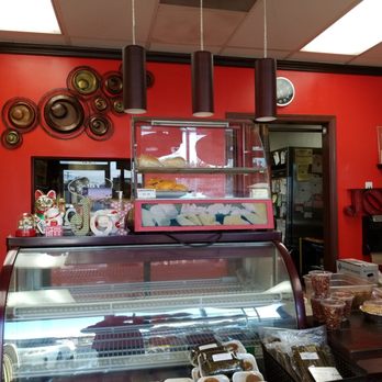 Joy Bakery - a woman standing in front of a display of pastries - Bakeries Near Me - Carson, California Joy Bakery - a woman standing in front of a display of pastries - Bakeries Near Me - Carson, California