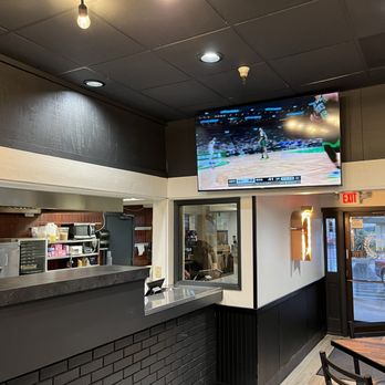 Round Table Pizza - a large flat screen tv - Pizza Near Me - Scotts Valley, California