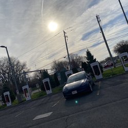Tesla Supercharger - 8 stalls located in the parking lot of a hotel conference center