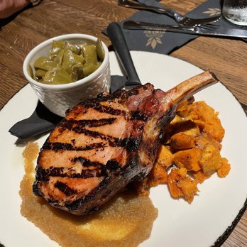 The Pinery - Frenched pork chop, medium, honey roasted sweet potatoes, bourbon apple sauce, green beans - American Near Me - Orlando, Florida The Pinery - Frenched pork chop, medium, honey roasted sweet potatoes, bourbon apple sauce, green beans - American Near Me - Orlando, Florida