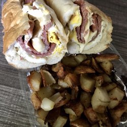 D & J's Atco Deli - Pork roll, fried egg & cheese on a long roll with a side of home fries with onions