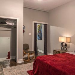 StarBike Nola Guest Quarters - 1 of 2 bedrooms with queen size beds in the Moteaux Crash Pad.