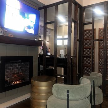 Chief’s Modern Cocktail Parlor - Allusion traditional fireplace w/ tv (inside) - Cocktail Bars Near Me - Charlotte, North Carolina