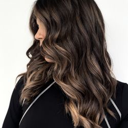 Elie Tanous Salon - Frace-framing warm highlights to match a face-framing haircut and texturized layers for movement, and reduced heaviness.
