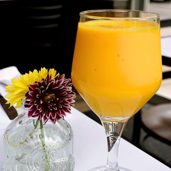 Anār Indian Restaurant - Mango Lassi: Ratnagiri mango pulp churned with yogurt & sprinkled with Kerala cardamom ($5.95 for 10 oz). - Indian Near Me - New York, New York Anār Indian Restaurant - Mango Lassi: Ratnagiri mango pulp churned with yogurt & sprinkled with Kerala cardamom ($5.95 for 10 oz). - Indian Near Me - New York, New York
