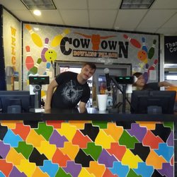 Cowtown Bowling Center - Colorful front desk and friendly associate.