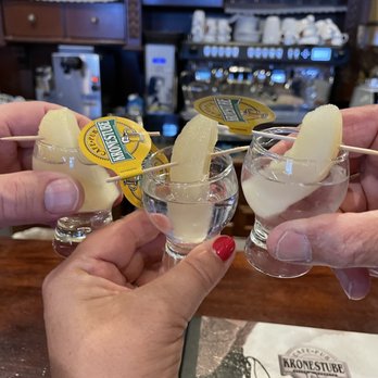 Kronestube - Pear shots all around - cheers! - Pubs Near Me - Selva di Val Gardena, BZ