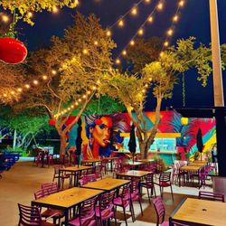 Lombardough's Pizza & Beer - Outdoor area at night. Order at the kiosk not window