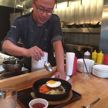 Mura Asian Eatery - Meet owner/chef Ted serving up pure deliciousness...Bibim Bowl with spicey pork! - Japanese Near Me - Seattle, Washington